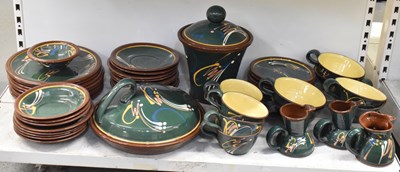 Lot 496 - A green glazed stoneware dinner service,...