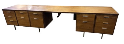 Lot 43 - A large mid century teak desk, width 320cm.