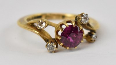 Lot 664 - An 18ct yellow gold ruby and diamond ring, set...