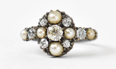 Lot 684 - A white metal diamond and seed pearl set ring,...