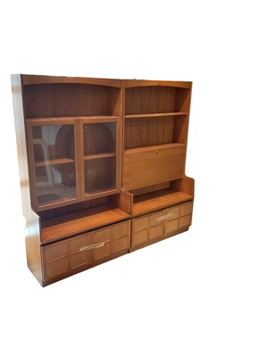 Lot 17 - Two teak mid century wall units, one with pair...