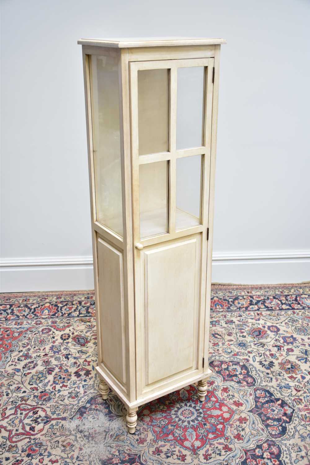 Lot 1144 - A modern white painted display cabinet with...