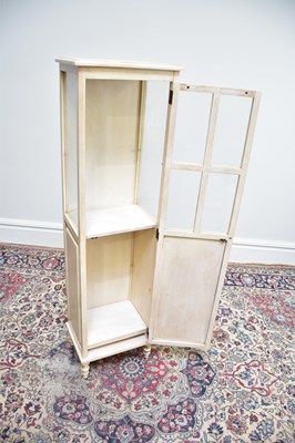 Lot 1144 - A modern white painted display cabinet with...