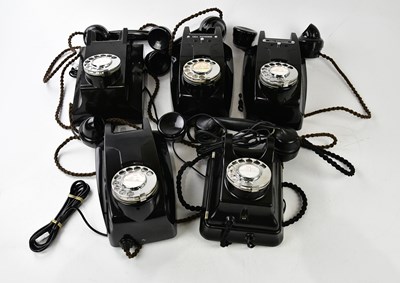 Lot 1015 - A collection of five bakelite rotary telephones