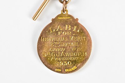 Lot 5 - A 9ct yellow gold bowling medal, given by Dr G...
