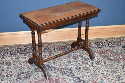 Lot 154 - A late Victorian walnut card table with swivel...