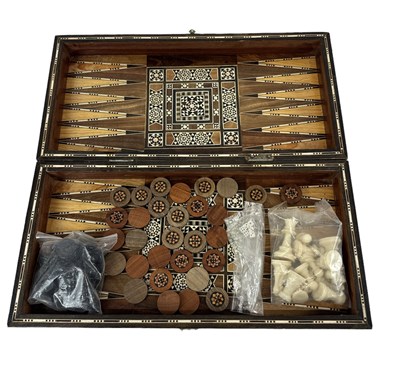 Lot 321 - A Middle Eastern mother of pearl inlaid games...