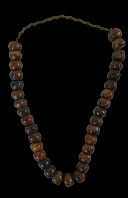 Lot 682 - A strand of cherry amber beads, length approx...