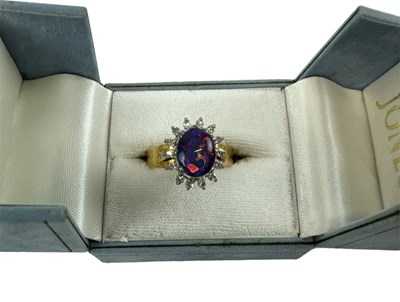 Lot 662 - An 18ct yellow gold opal and diamond set...