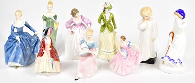 Lot 2709 - ROYAL DOULTON; a collection of nine figures,...