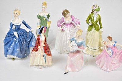 Lot 2709 - ROYAL DOULTON; a collection of nine figures,...