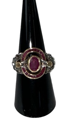 Lot 653 - A yellow metal ruby and diamond set ring, the...