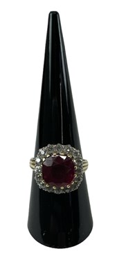 Lot 652 - A yellow metal red stone and diamond cluster...