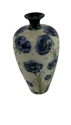 Lot 485 - MOORCROFT; a Florian Ware blue 'Poppy' vase,...