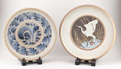 Lot 663 - WENDY NOLAN; two stoneware chargers decorated...