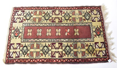 Lot 102 - A hand-knotted red ground rug, 144 x 90cm.