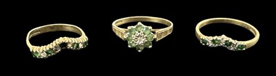 Lot 680 - A 9ct yellow gold emerald and diamond set...