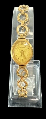 Lot 859 - ACCURIST; a lady's 9ct yellow gold wristwatch,...