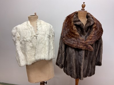 Lot 85 - A faux fur jacket, a mink stole, and a cream...