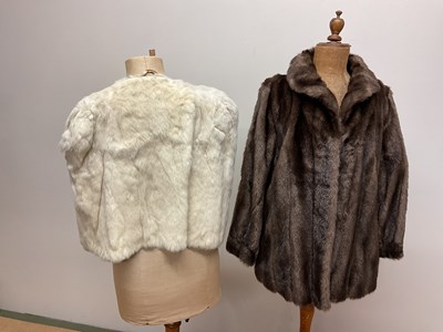 Lot 85 - A faux fur jacket, a mink stole, and a cream...