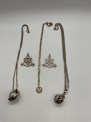 Lot 484 - MASONIC INTEREST; two silver orb necklaces, a...