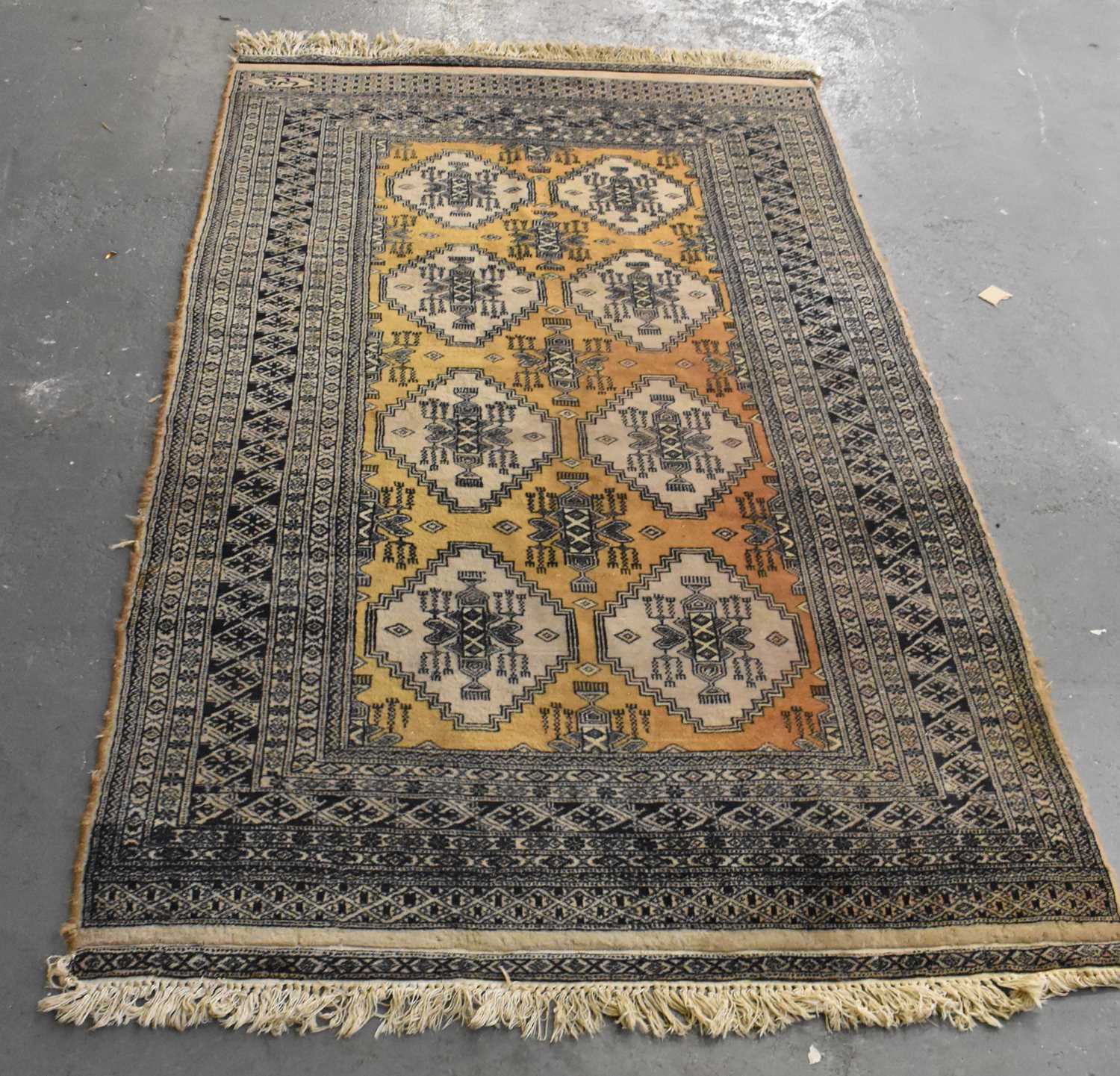 Lot 129 A brown ground Asian style carpet with