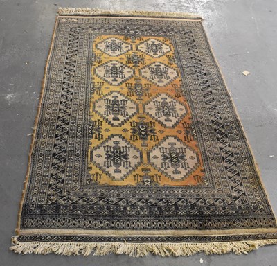 Lot 129 - A brown ground Asian style carpet with...