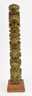 Lot 1062 - RAYMOND WILLIAMS; a carved wooden totem pole,...