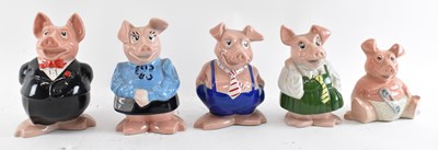 Lot 512 - A set of five Wade NatWest pigs.