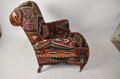 Lot 1581 - A Victorian style armchair, upholstered in a...
