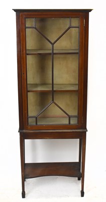 Lot 1582 - An Edwardian inlaid mahogany display cabinet,...