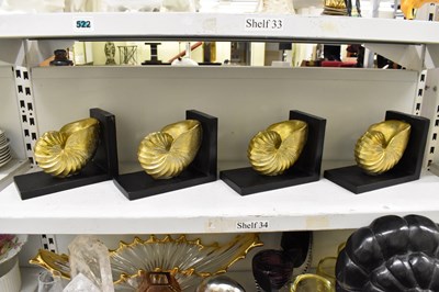 Lot 372 - Two pairs of gilt shell decorated bookends.