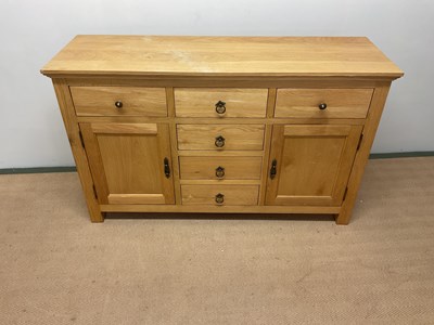 Lot 698 - A contemporary six drawer, two cupboard...