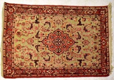 Lot 56 - An Afghan Beluch mauve ground hand knotted rug