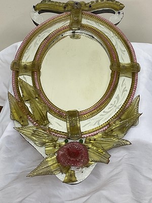 Lot 688 - A small Venetian oval wall mirror with pink...