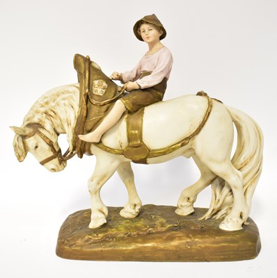 Lot 339 - ROYAL DUX; a figure of a boy riding a shire...