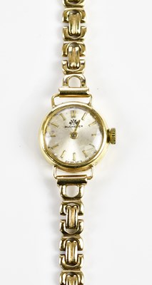 Lot 592 - BUCHERER; a lady's vintage gold wristwatch...