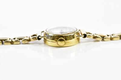 Lot 592 - BUCHERER; a lady's vintage gold wristwatch...