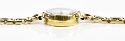 Lot 592 - BUCHERER; a lady's vintage gold wristwatch...