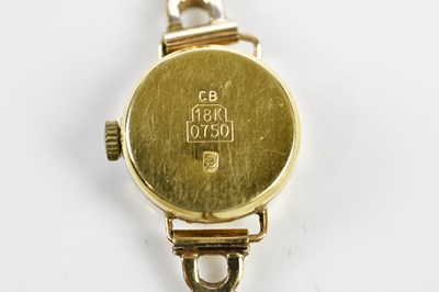 Lot 592 - BUCHERER; a lady's vintage gold wristwatch...