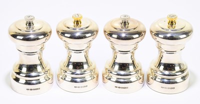 Lot 237 - A set of four modern silver pepper and salt...