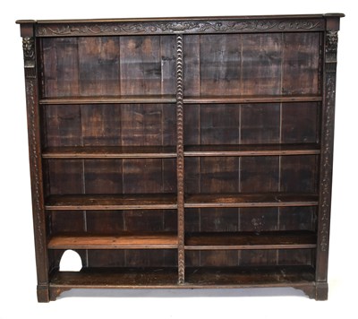Lot 45 - An oak Medieval-style double bookcase, with...