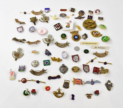 Lot 2602 - A collection of military badges to include a...