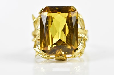 Lot 166 - A yellow metal and citrine large dress ring,...