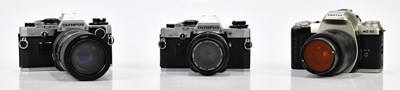 Lot 451 - OLYMPUS; two Olympus OM10 35mm film cameras,...