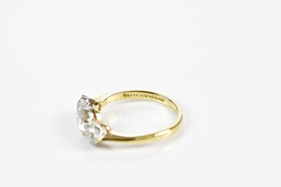 Lot 45 - An 18ct yellow gold three stone diamond ring,...