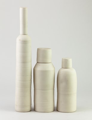 Lot 814 - A trio of cylindrical porcelain jars and...