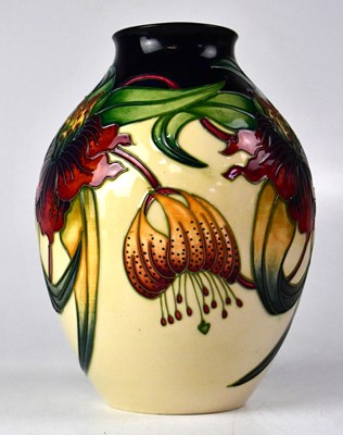 Lot 349 - MOORCROFT; an 'Anna Lily' cream ground vase,...