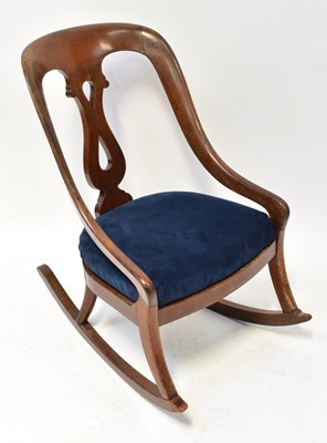 Lot 18 - A 19th century mahogany rocking chair with...