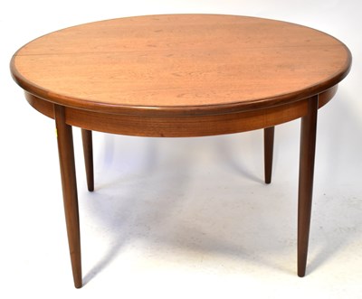 Lot 35 - G-PLAN; an extending circular table, 75 x 120...